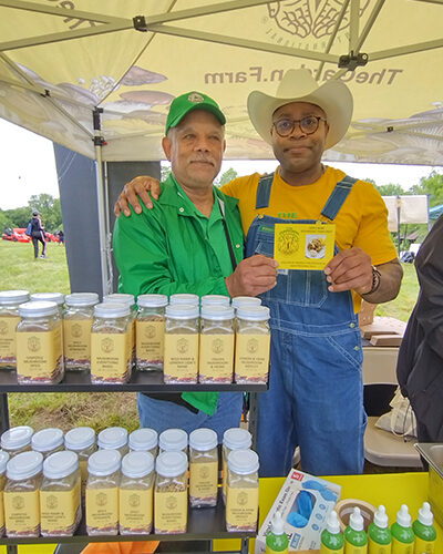 Farmers share their goods at a farmers market.