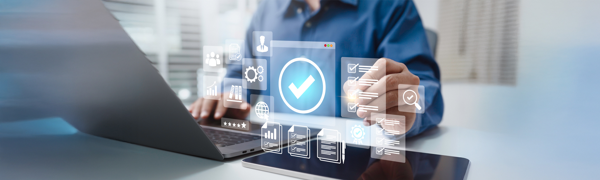 Man at computer with large checkmark hovering above the keyboard. Photo by by-Khanchit-Khirisutchalual, istockphoto.com.