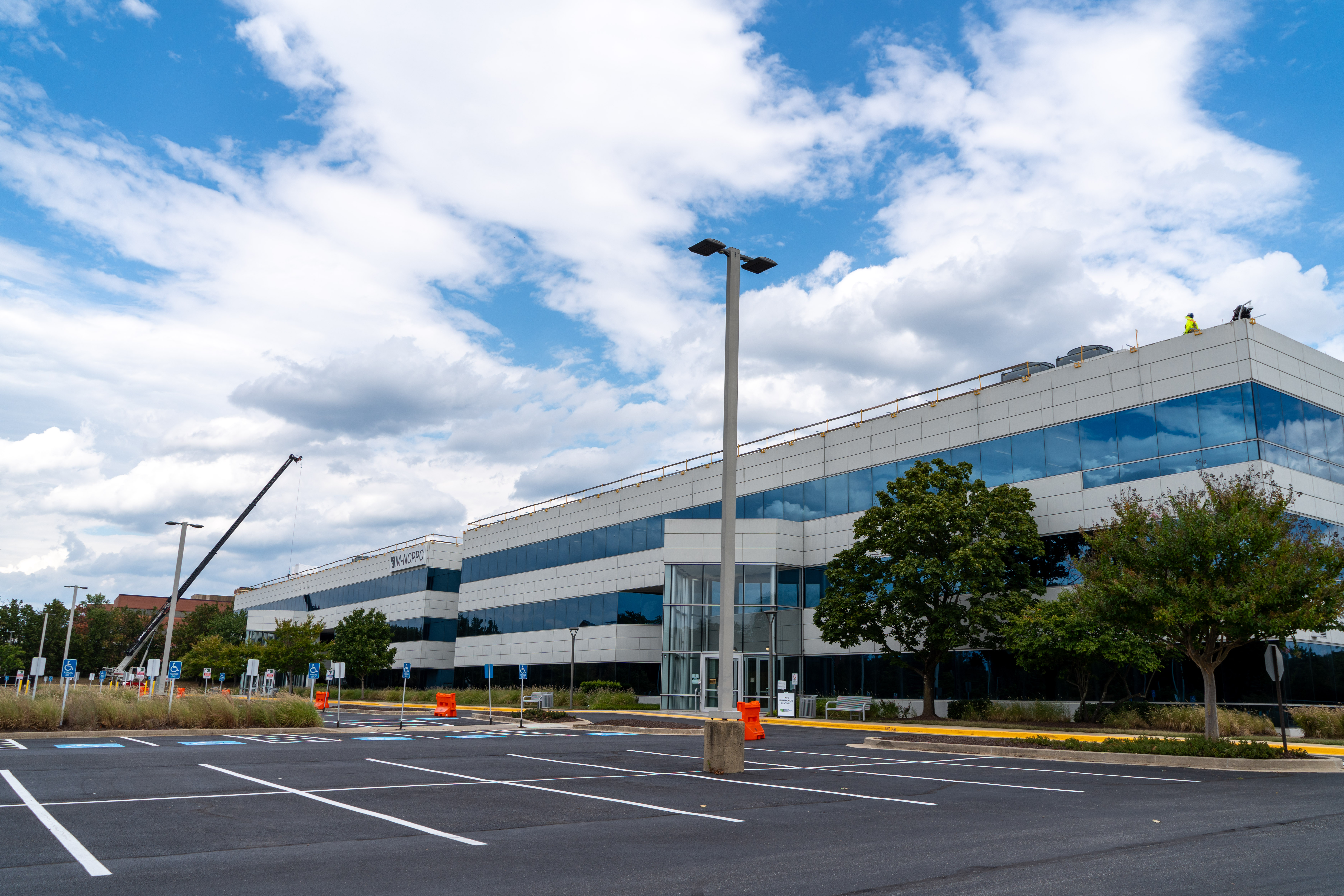 Construction crane looms over the M-NCPPC Largo Headquarters during the first phase of needed building updates.
